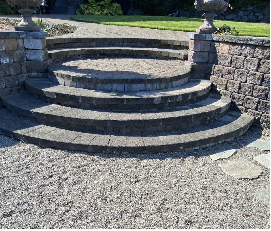 Curved paver steps with retaining wall