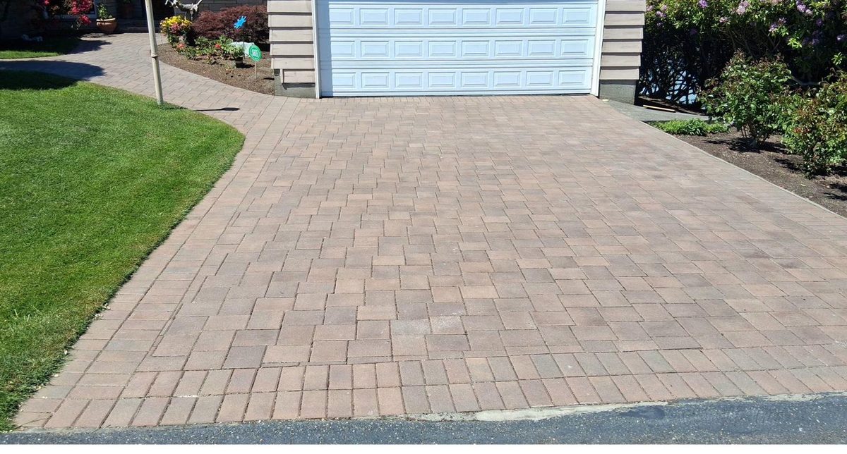Paver driveway with clean herringbone pattern