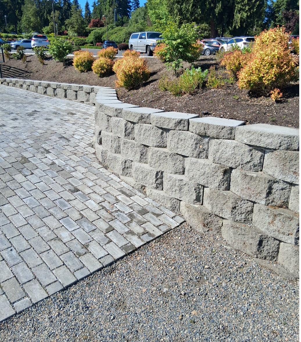 Paver area with retaining wall and landscaping
